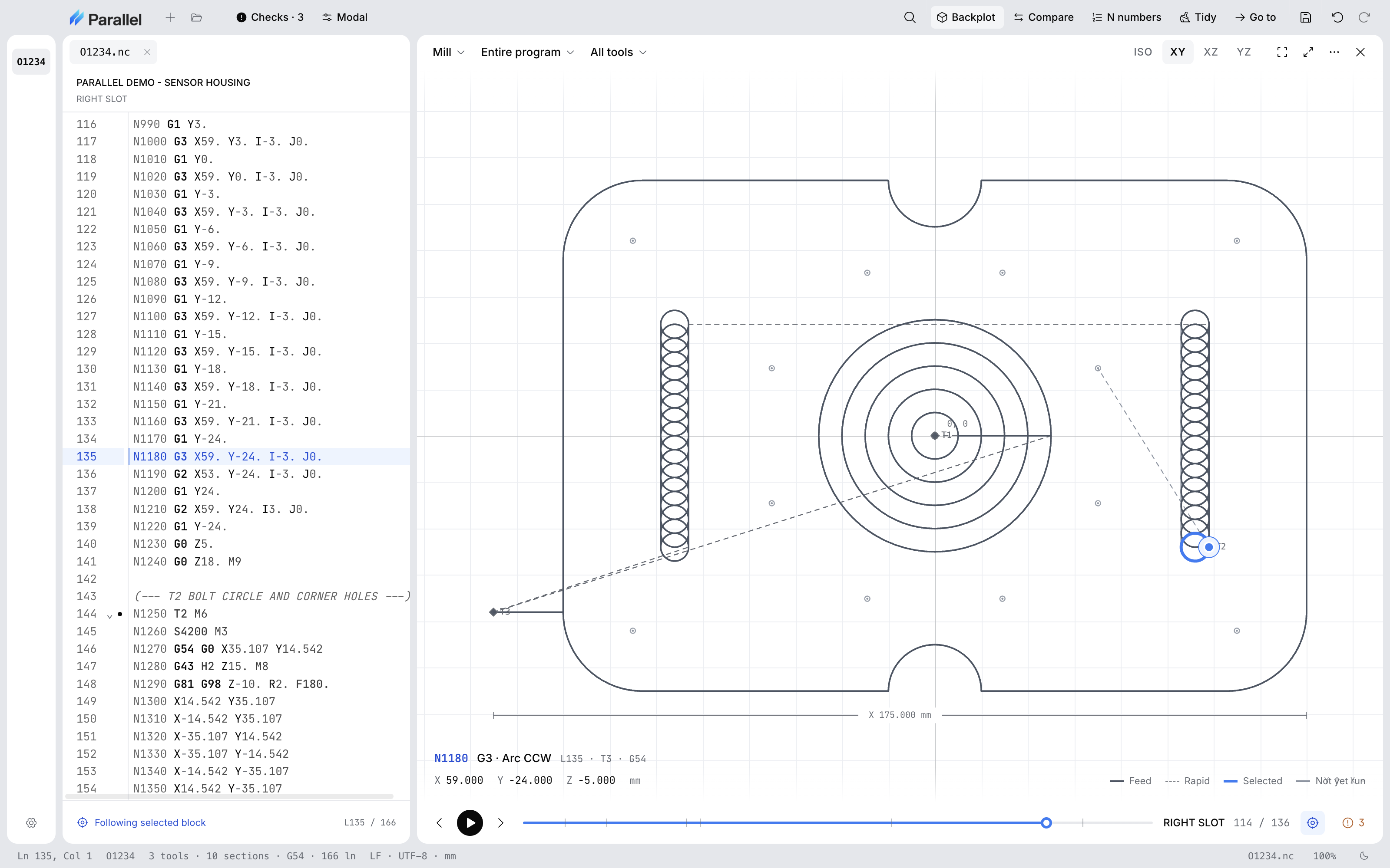Parallel Desktop showing a sensor housing program beside an XY mill backplot with a notched outer profile, a center bore cleared in concentric rings, two trochoidal slots, and a bolt circle with corner holes, with the selected block and its position read out under the plot