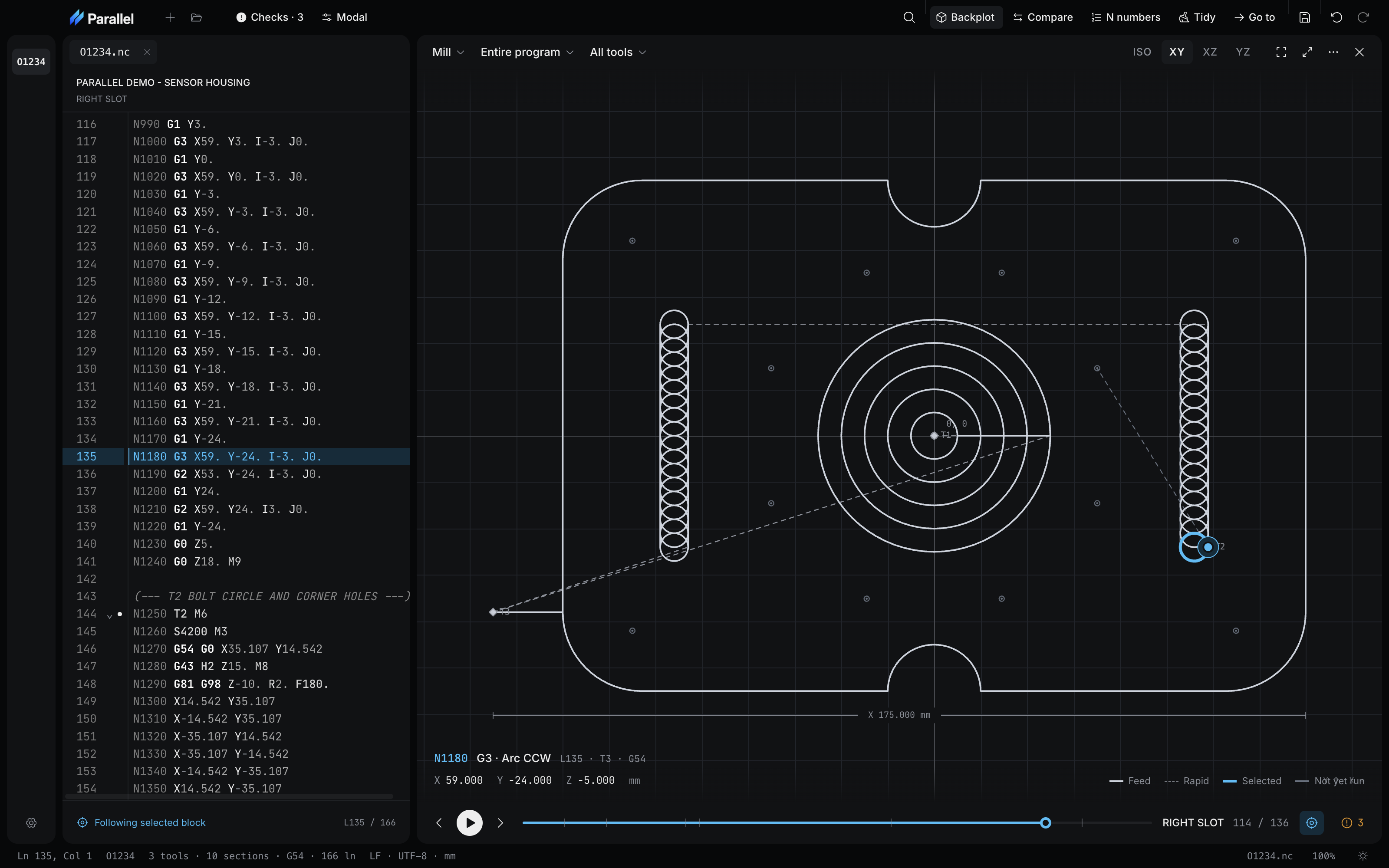Parallel Desktop showing a sensor housing program beside an XY mill backplot with a notched outer profile, a center bore cleared in concentric rings, two trochoidal slots, and a bolt circle with corner holes, with the selected block and its position read out under the plot